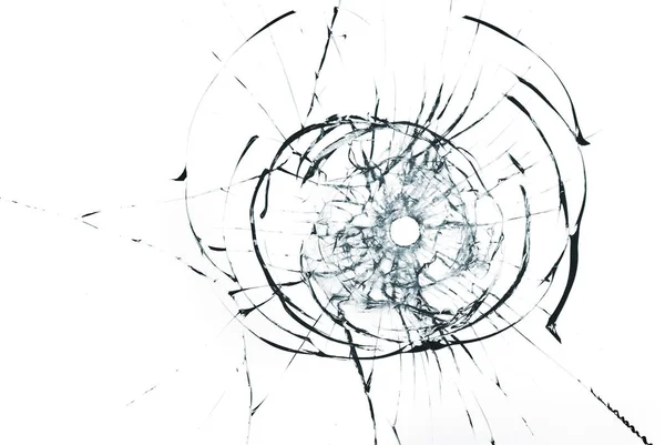 하얀 배경 가까이에 있는 유리 구멍 속의 총알 자국 — 스톡 사진