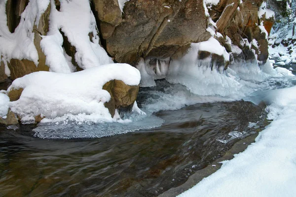 Frozen ice waterfall on the rock Stock Image