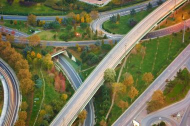 Aerial View Above of Highway Road Junctions at Sunset. The Intersecting Freeway Road Overpass. Istanbul clipart