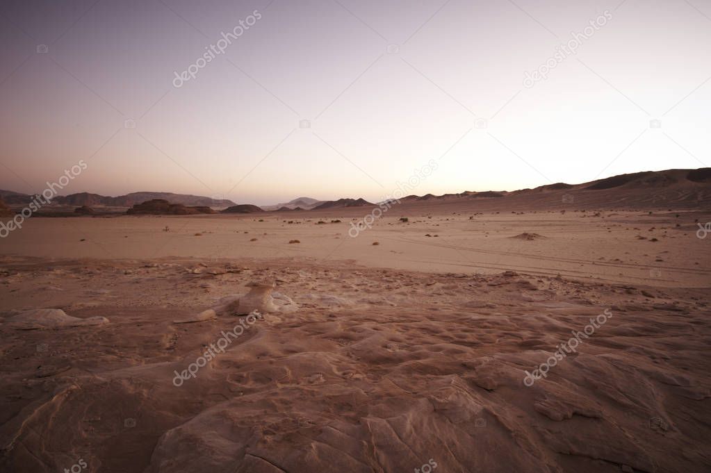 Valley in the Sinai desert with mountains and sun