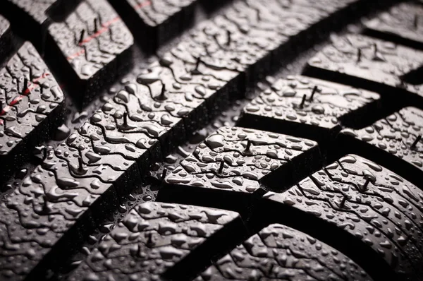 Brand new winter tire pattern on black background