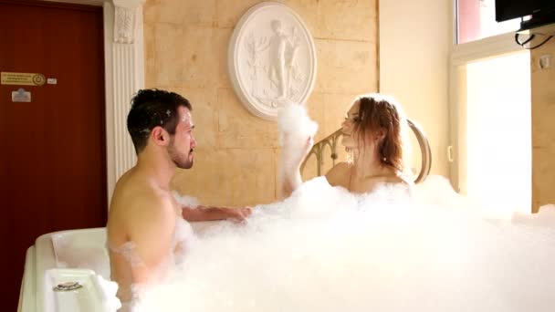 Girl and Guy in the Jacuzzi with Foam — Stock Video