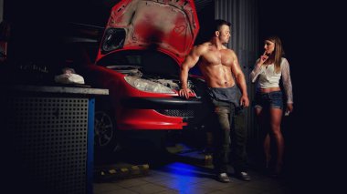 A woman in the garage experiences a sexual attraction to a man with an car mechanic clipart
