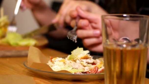 People touch their dishes with forks — Stock Video