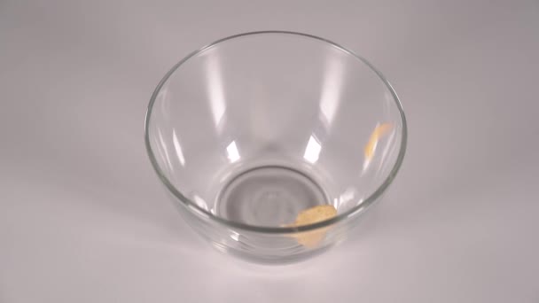 Sweet Fluffy Caramel Popcorn Pouring Transparent Class Bowl White Table — Stock Video