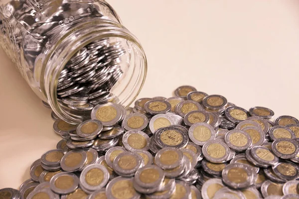 A lot of mexican pesos in jar — Stock Photo, Image