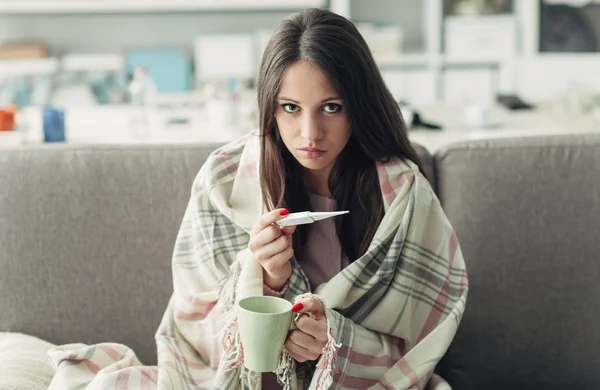 Sick woman taking temperature — Stock Photo, Image