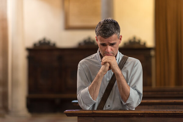 Man praying in the Church