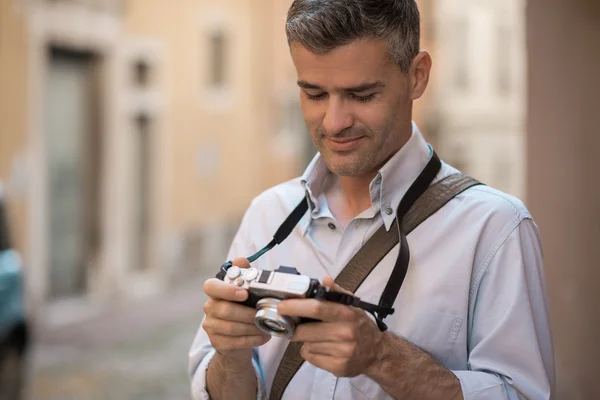 Photographer checking pictures previews — Stock Photo, Image