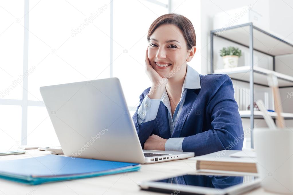 Confident female executive posing