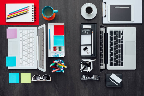 Customized office workspace: creative and colorful desktop on one side, rational and monochromatic on the other side