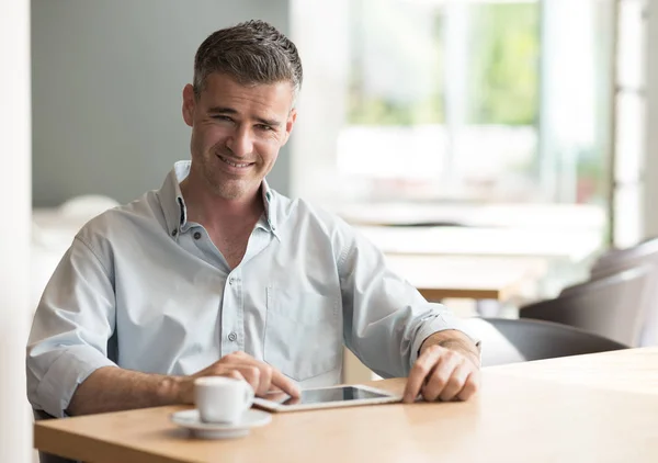 Confident businessman having an espresso — Stock Photo, Image