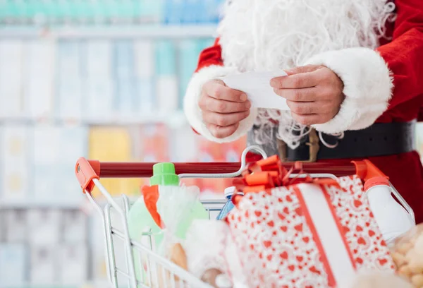 Santa Claus robi zakupy świąteczne — Zdjęcie stockowe