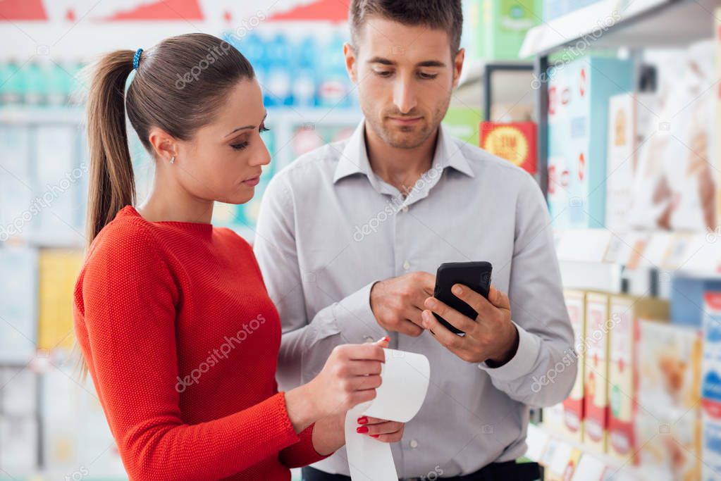 Couple shopping and checking receipt