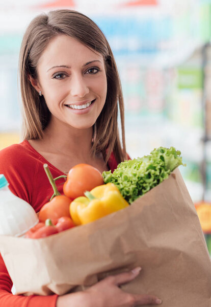 Woman holding grocery bag