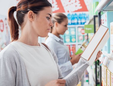 Women shopping at supermarket clipart