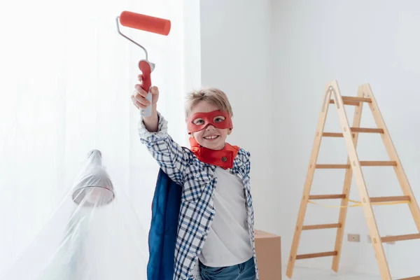Cute superhero boy with mask and cape — Stock Photo, Image