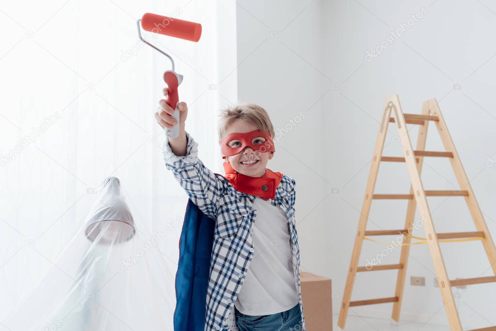 Cute superhero boy with mask and cape
