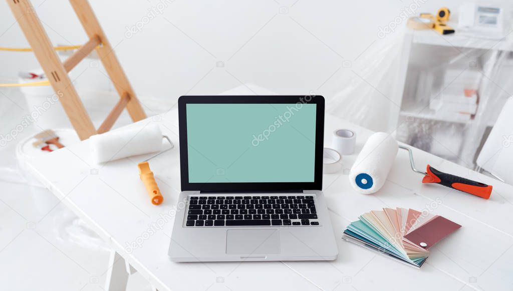laptop on desktop with color swatches