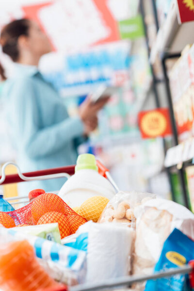 Full shopping cart at supermarket  