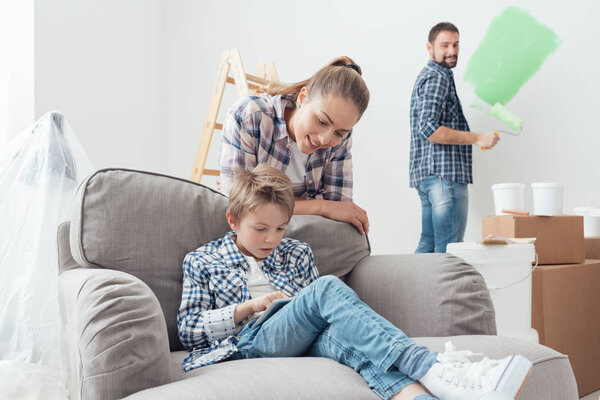 Boy with mother connecting with tablet 