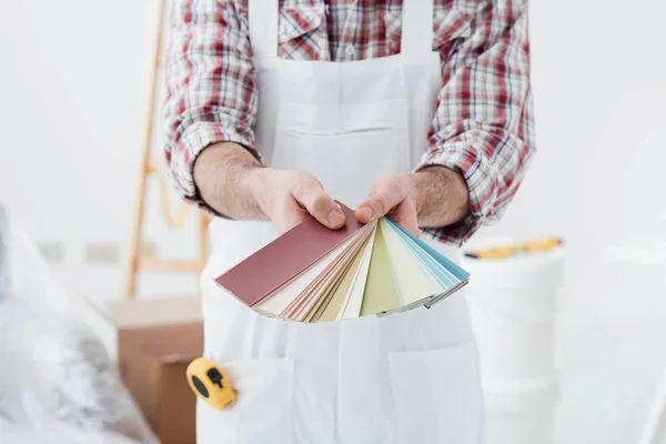 Painter showing set of color swatches — Stock Photo, Image