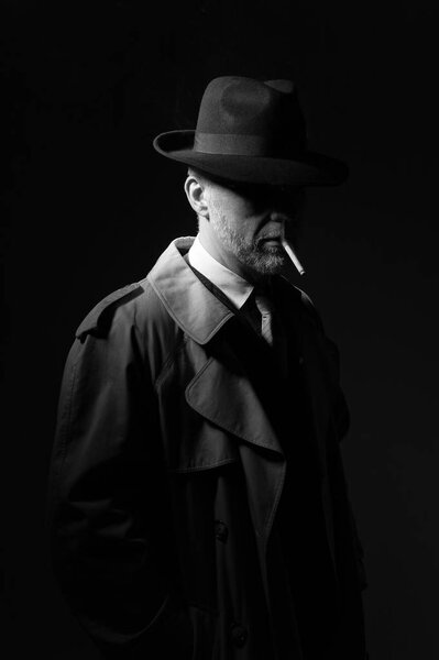 Man smoking cigarette in dark 