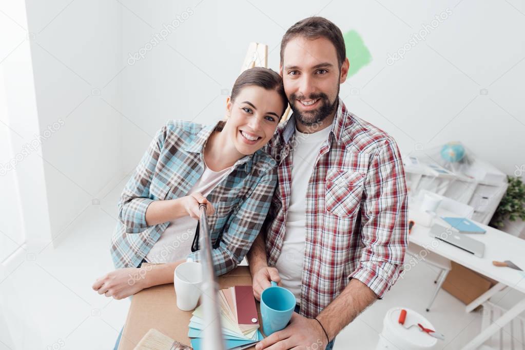 Smiling young couple taking selfie