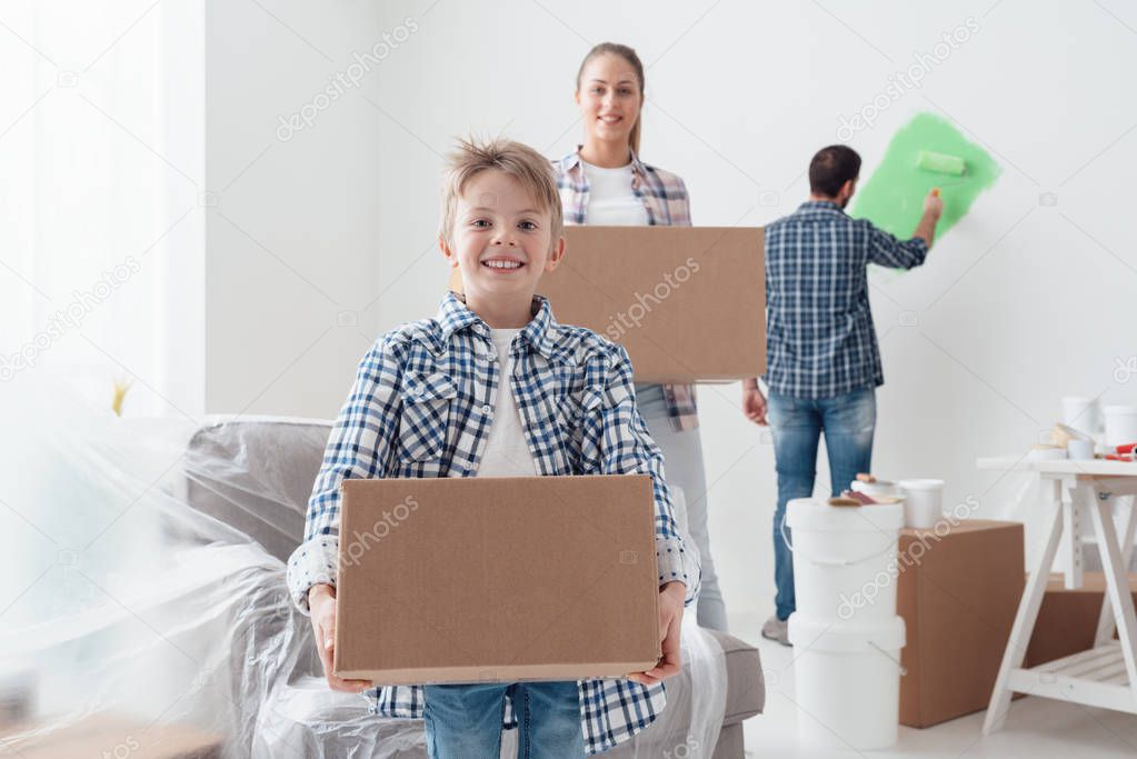 boy and mother carrying boxes