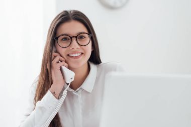 smiling secretary answering phone calls  clipart