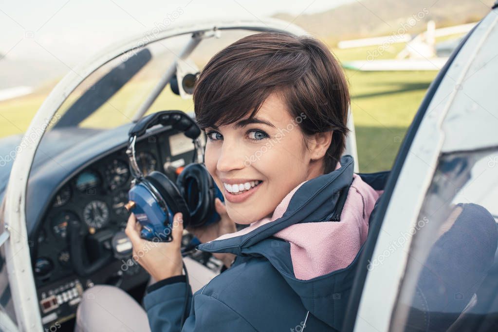 Female pilot in aircraft cockpit