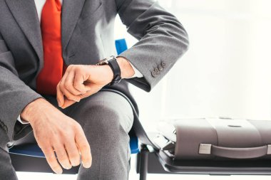 Corporate businessman checking time clipart