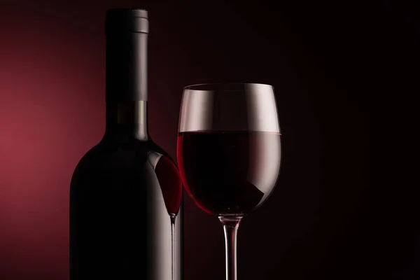 Wine bottle and full glass — Stock Photo, Image