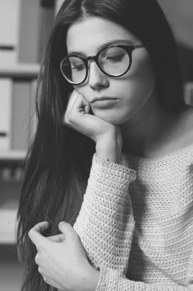 Unhappy young woman looking down