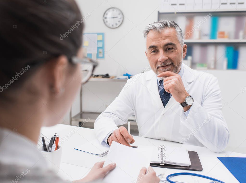 doctor meeting with patient in office