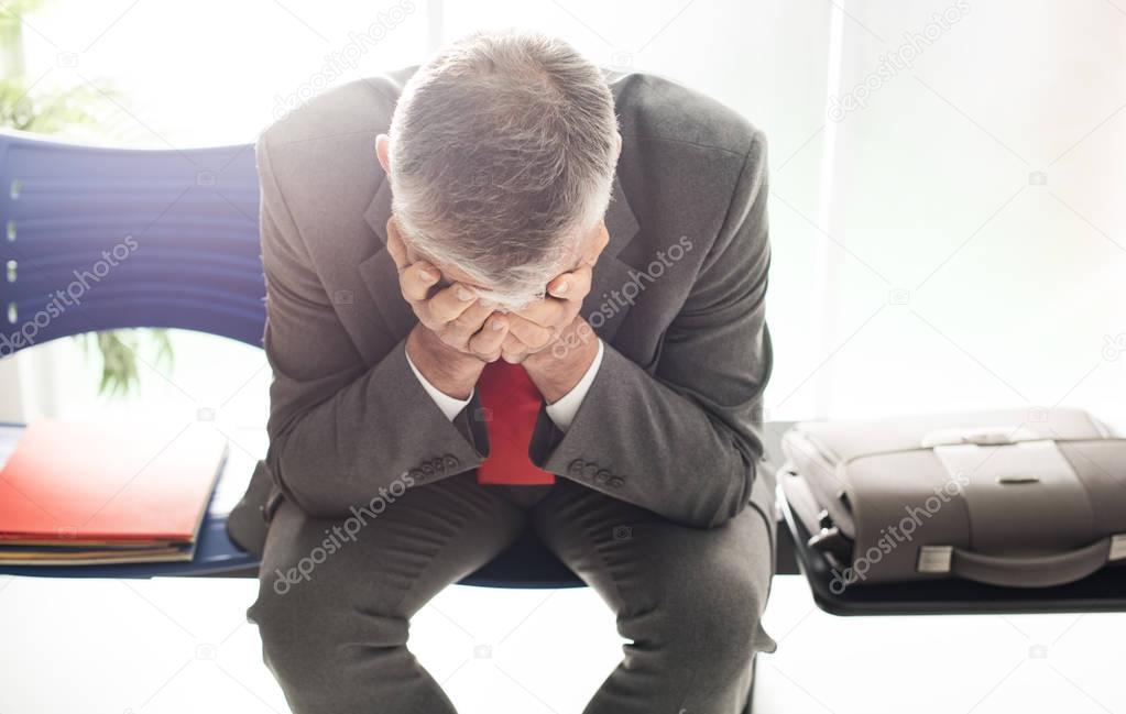 Desperate businessman in waiting room