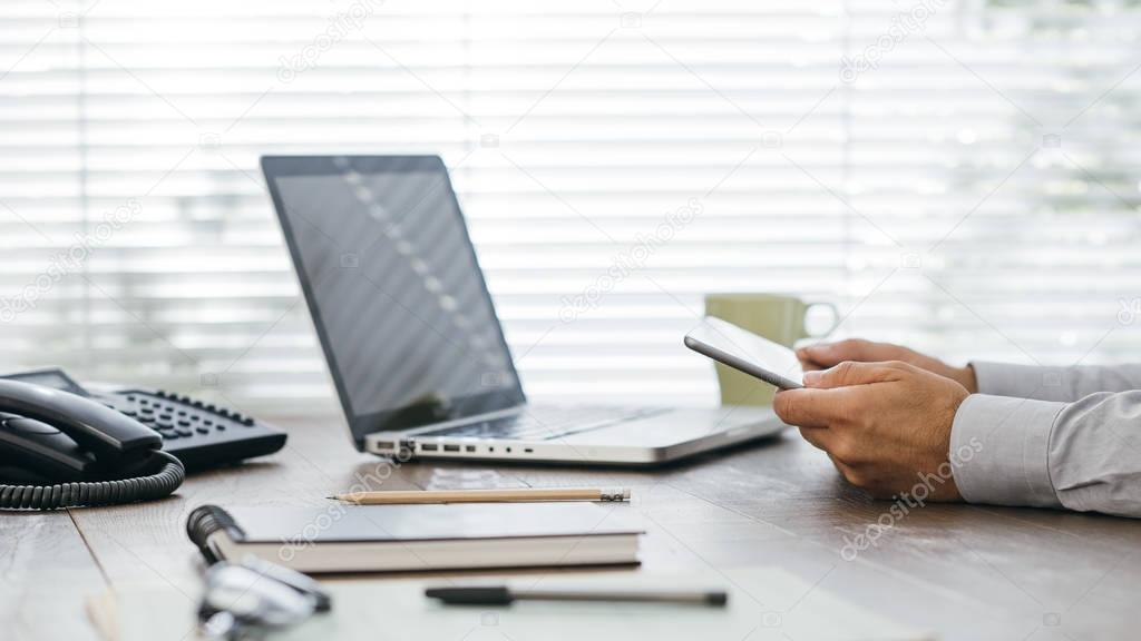 Businessman working at office desk