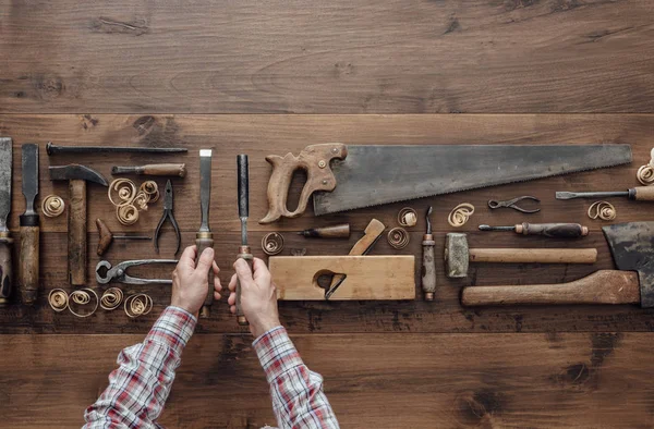 Carpenter holding chisel and gouge — Stock Photo, Image