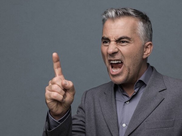 Boss pointing with finger and yelling