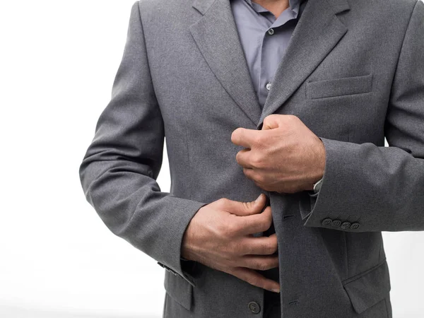 Zakenman unbuttoning jas — Stockfoto