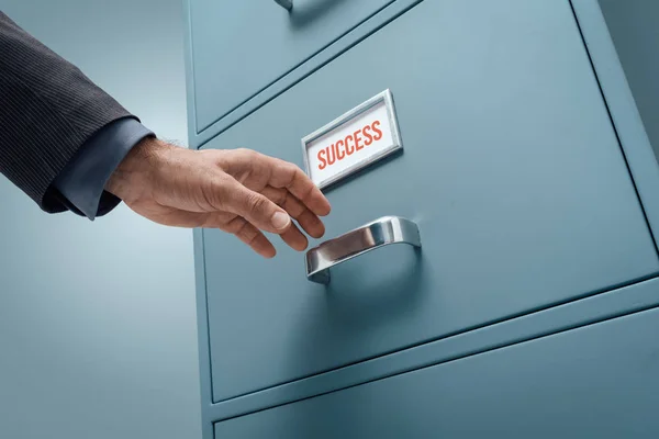 Businessman opening drawer — Stock Photo, Image