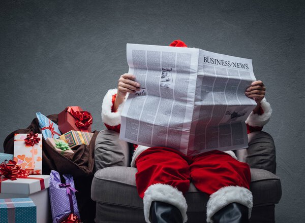 Santa Claus reading business news