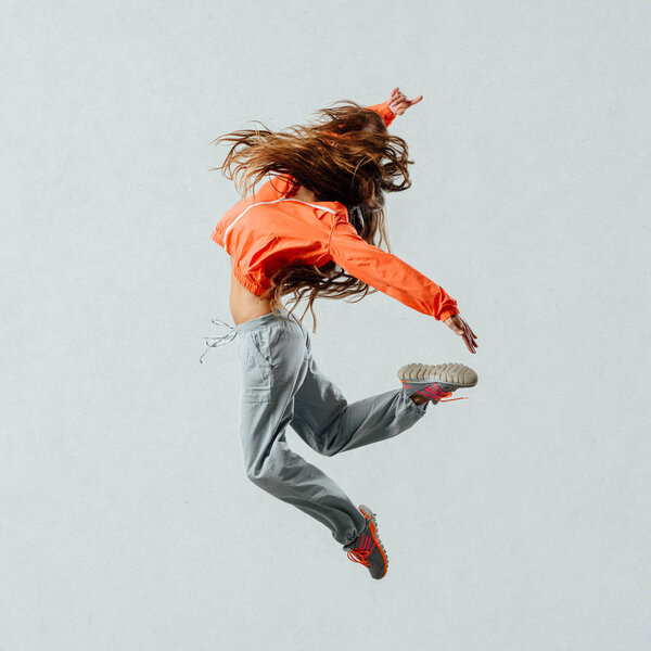 Athletic dancer jumping and moving
