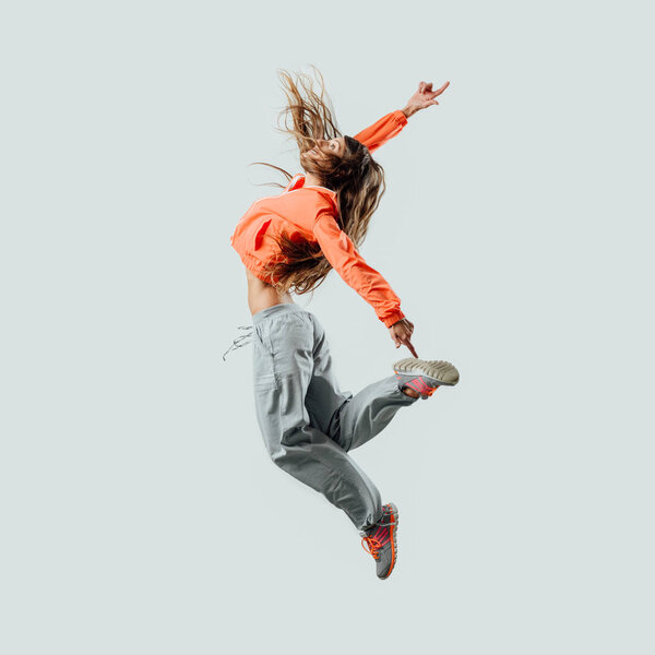 Athletic dancer jumping and moving
