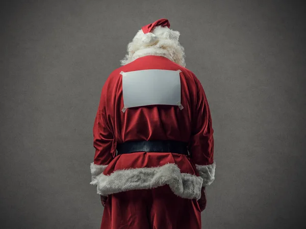 Weihnachtsmann mit leerem Schild auf dem Rücken — Stockfoto