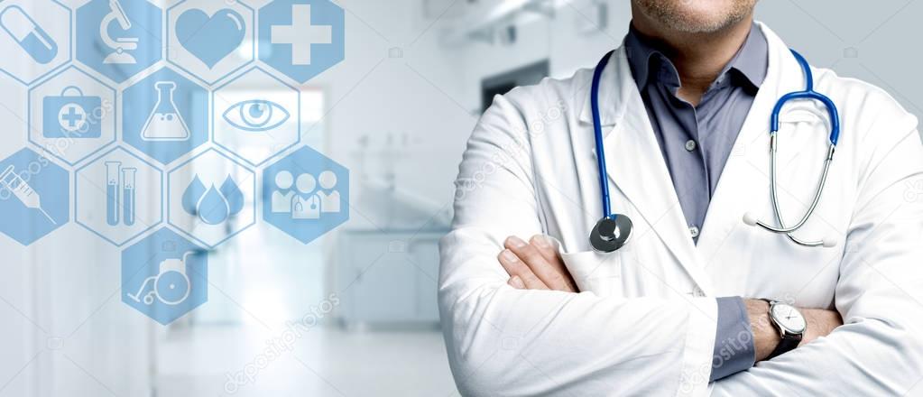 Confident doctor posing with arms crossed and medical icons interface, healthcare and technology concept
