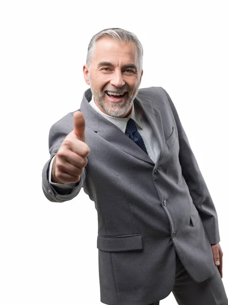 Confident businessman giving thumb up — Stock Photo, Image