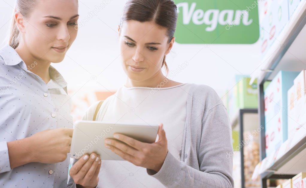 Young women shopping vegan products