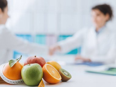 Professional nutritionist meeting a patient  clipart