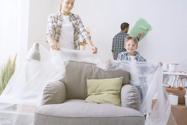 Happy young family renovating home — Stock Photo, Image